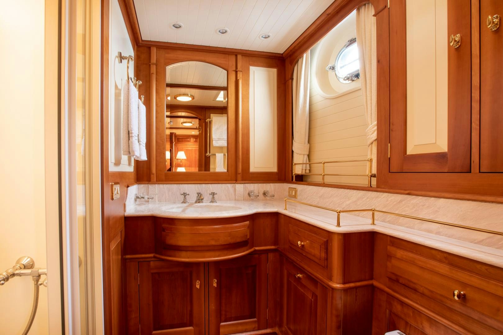 a bathroom with a large mirror aboard AUDREY II Yacht for Sale