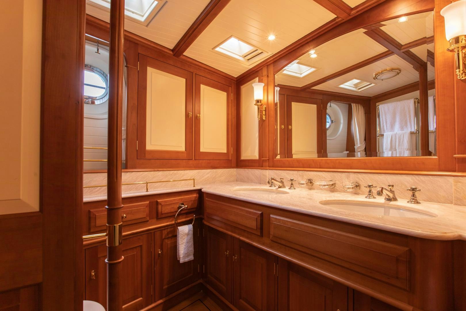 a bathroom with a large mirror aboard AUDREY II Yacht for Sale