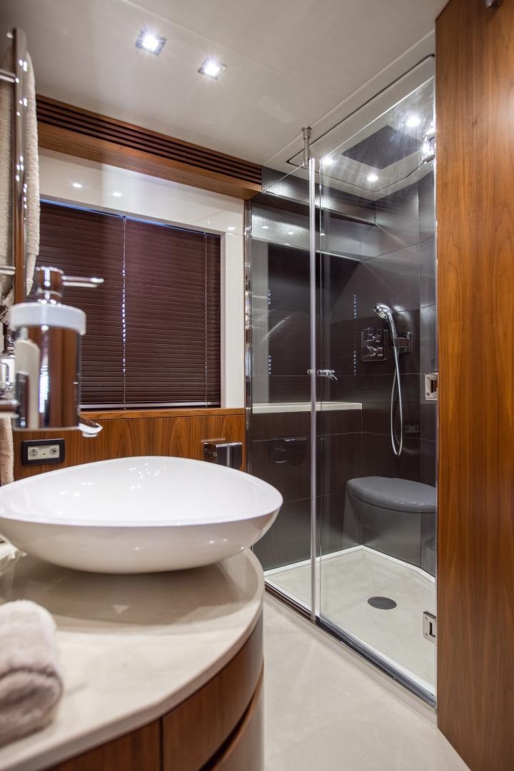 a bathroom with a sink and shower aboard FREAKY FRANKS Yacht for Sale
