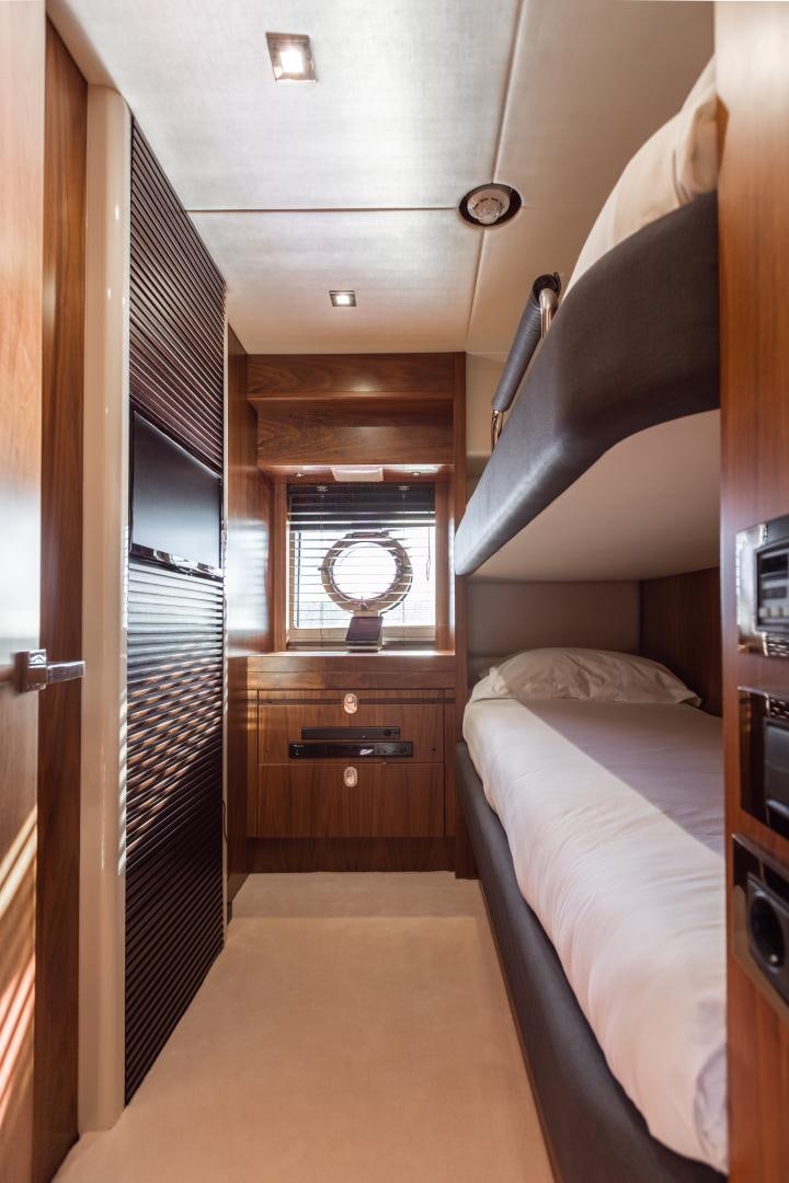 a bedroom with a bed and a window aboard FREAKY FRANKS Yacht for Sale