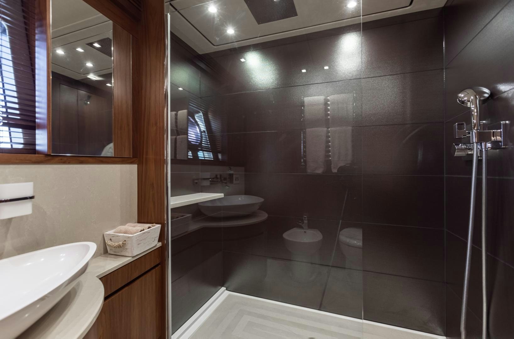 a bathroom with a large mirror aboard FREAKY FRANKS Yacht for Sale