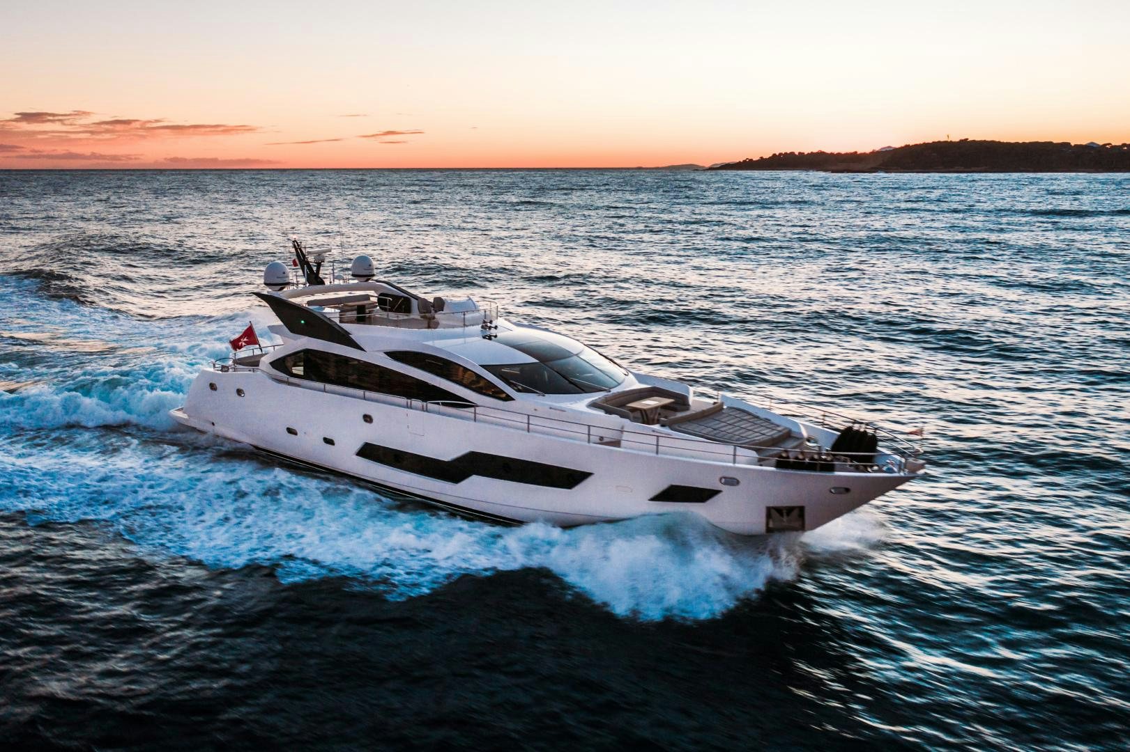 a white yacht on the water aboard FREAKY FRANKS Yacht for Sale