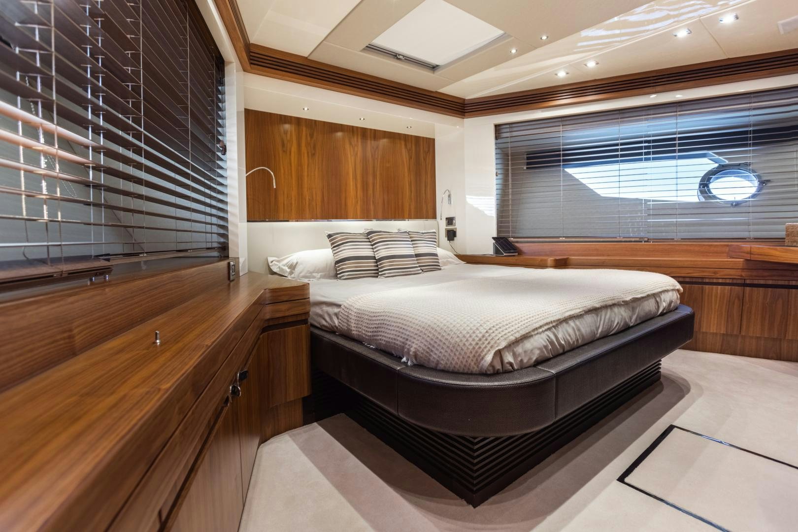 a room with a bed and a window aboard FREAKY FRANKS Yacht for Sale
