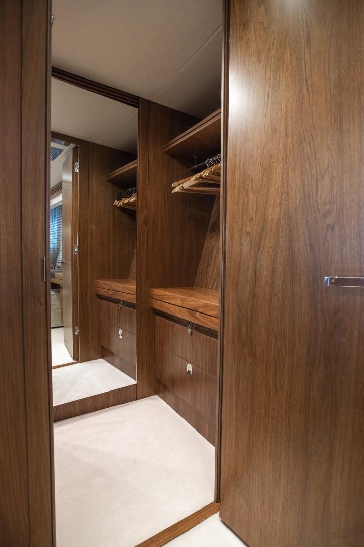 a wooden closet with a wood door aboard FREAKY FRANKS Yacht for Sale