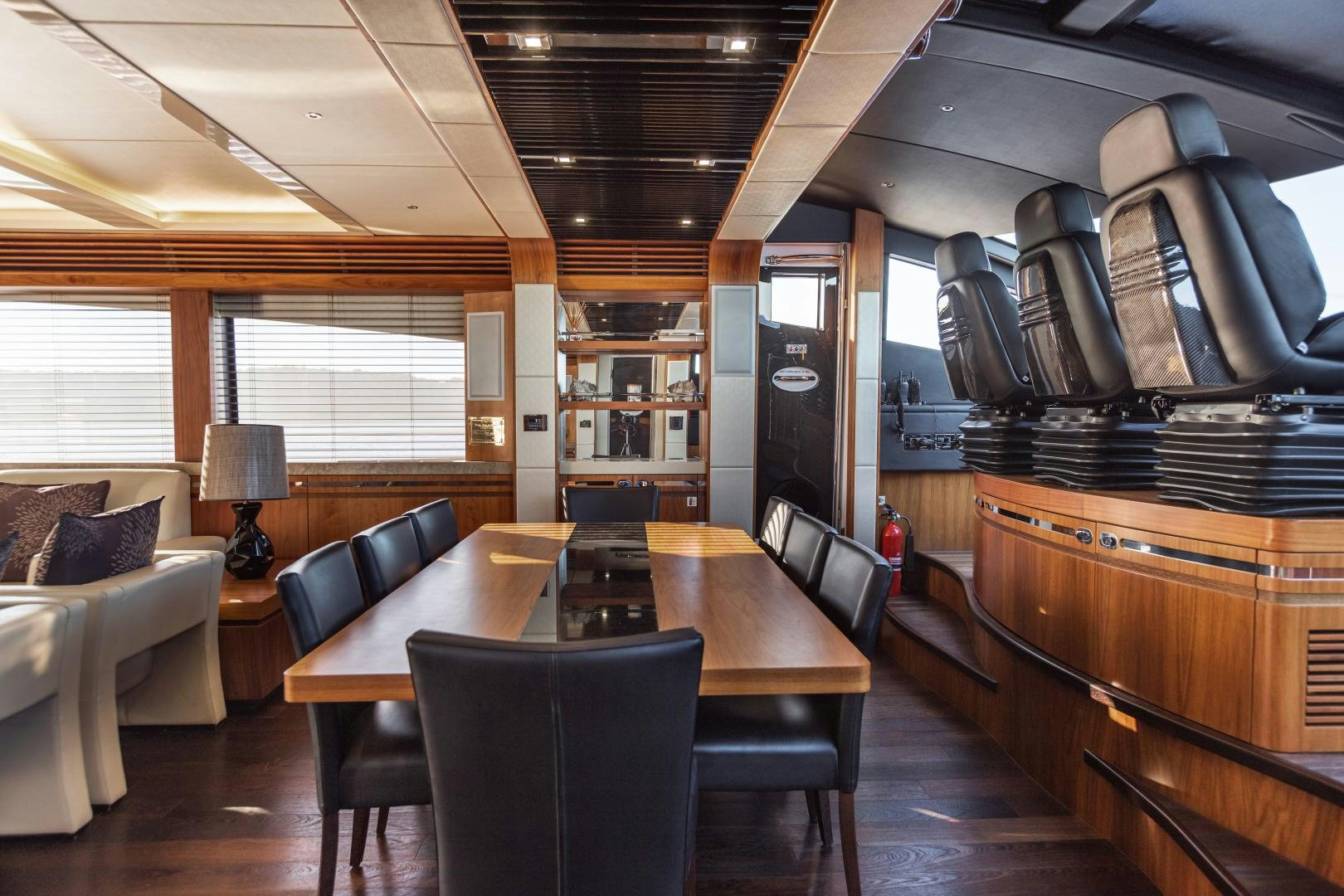 a large room with a table and chairs aboard FREAKY FRANKS Yacht for Sale