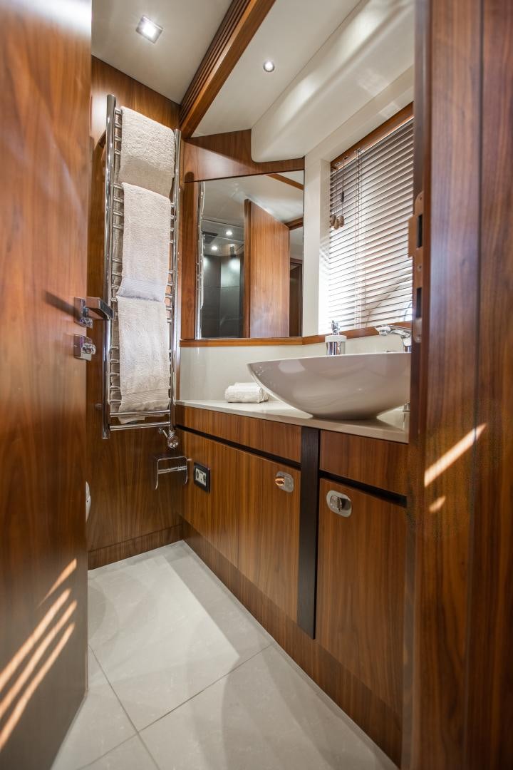 a bathroom with a sink and a mirror aboard FREAKY FRANKS Yacht for Sale