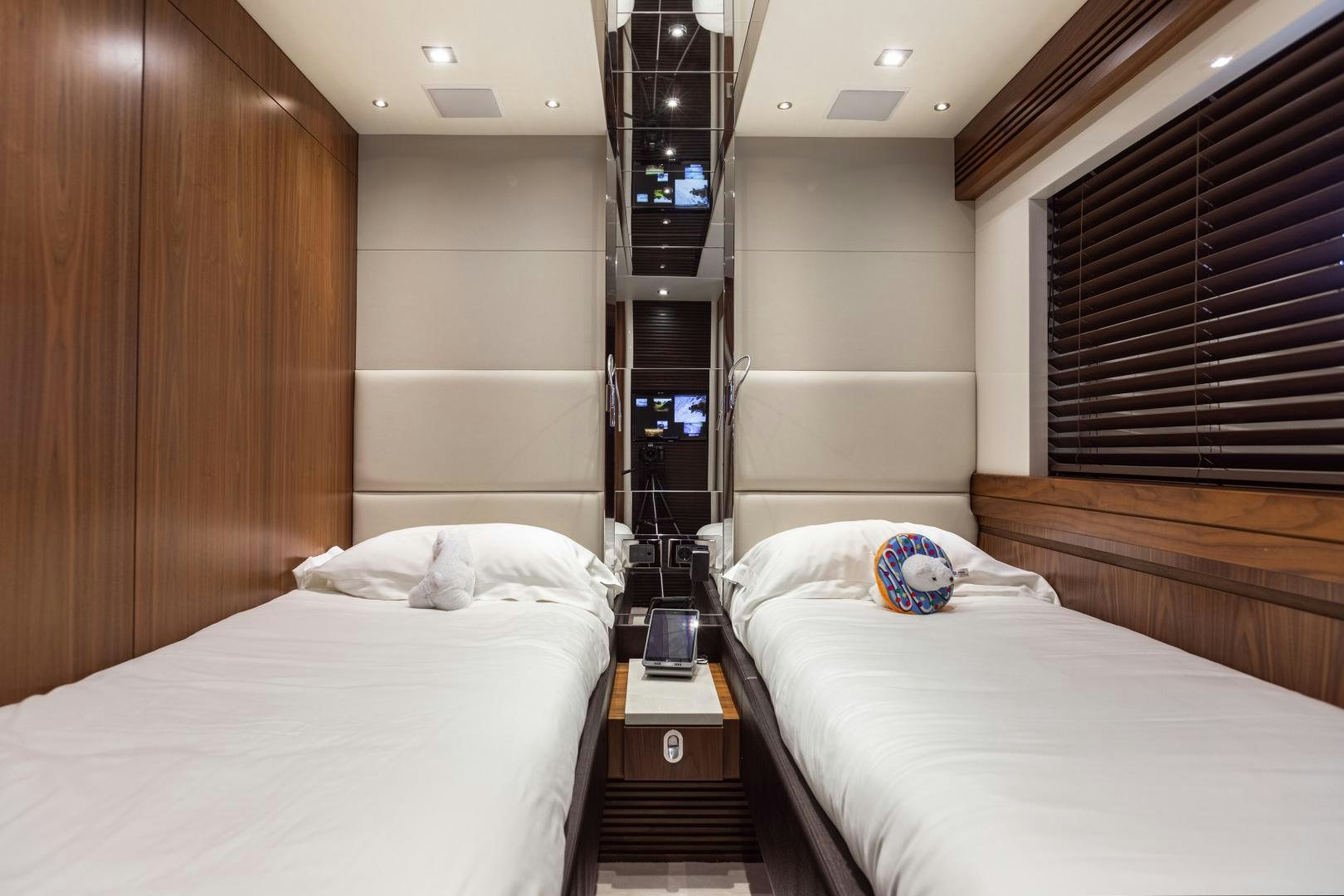 a room with a bed and a shelf with a lamp on it aboard FREAKY FRANKS Yacht for Sale