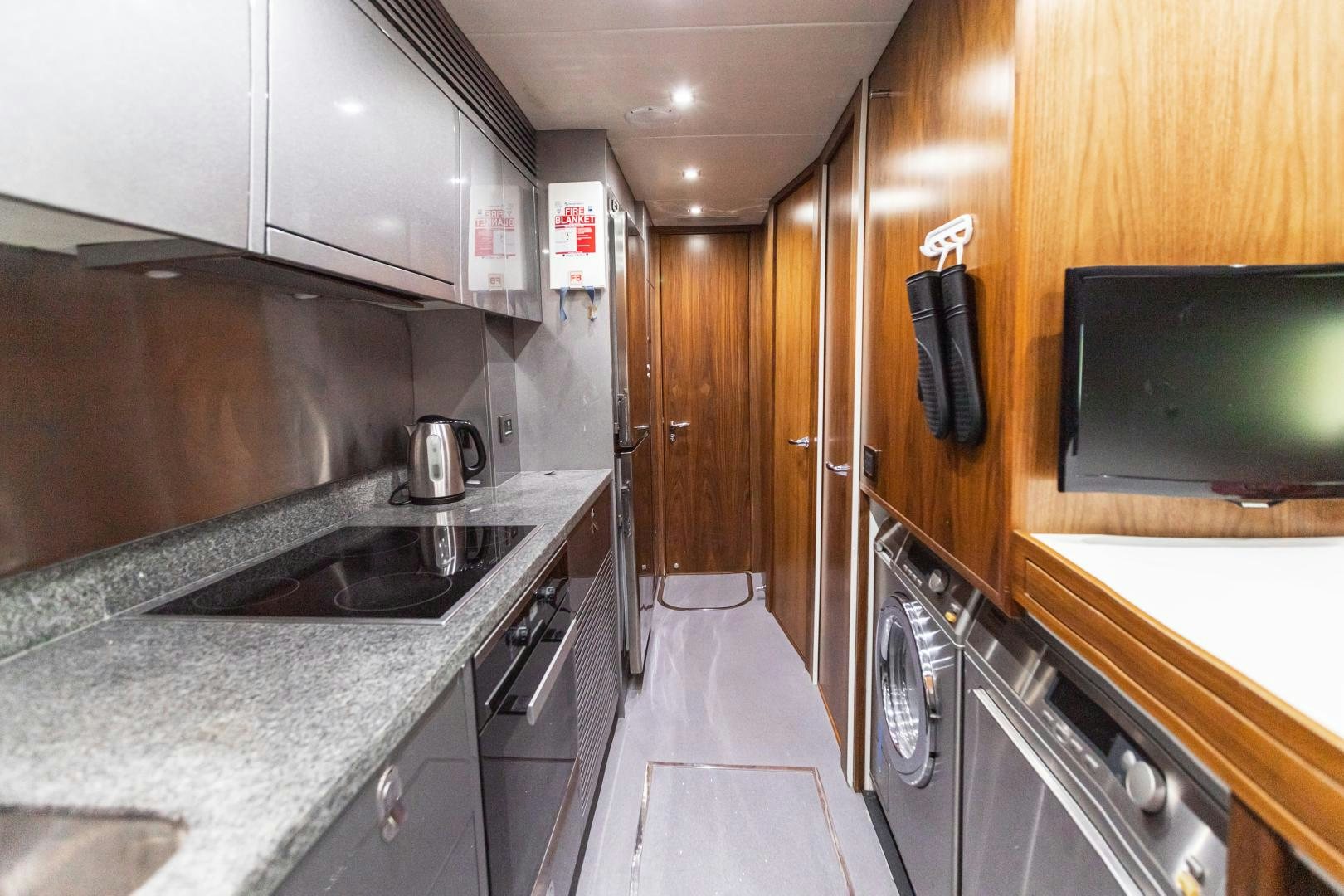 a kitchen with a sink and a microwave aboard FREAKY FRANKS Yacht for Sale