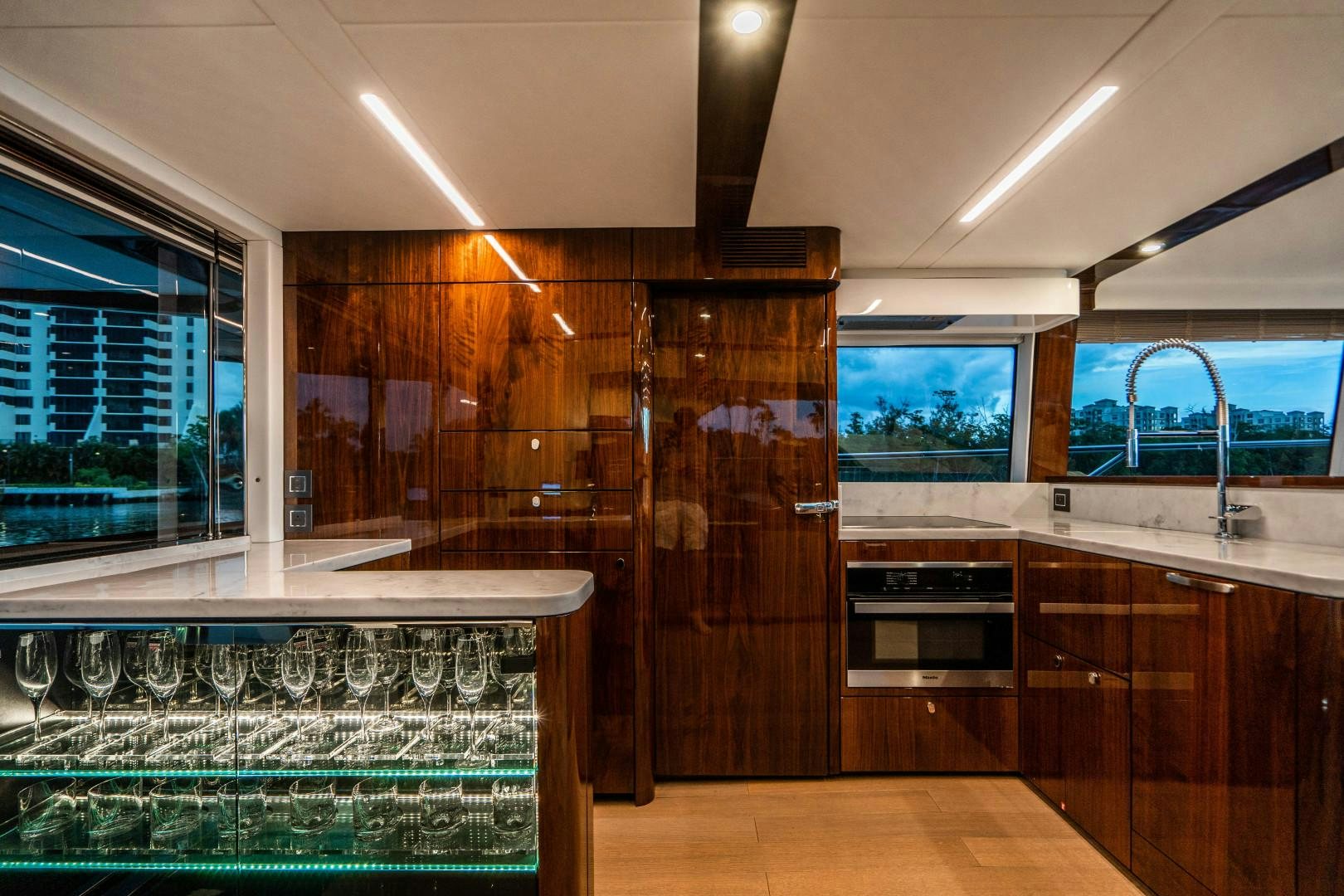 a kitchen with a glass wall aboard BLIND DATE Yacht for Sale
