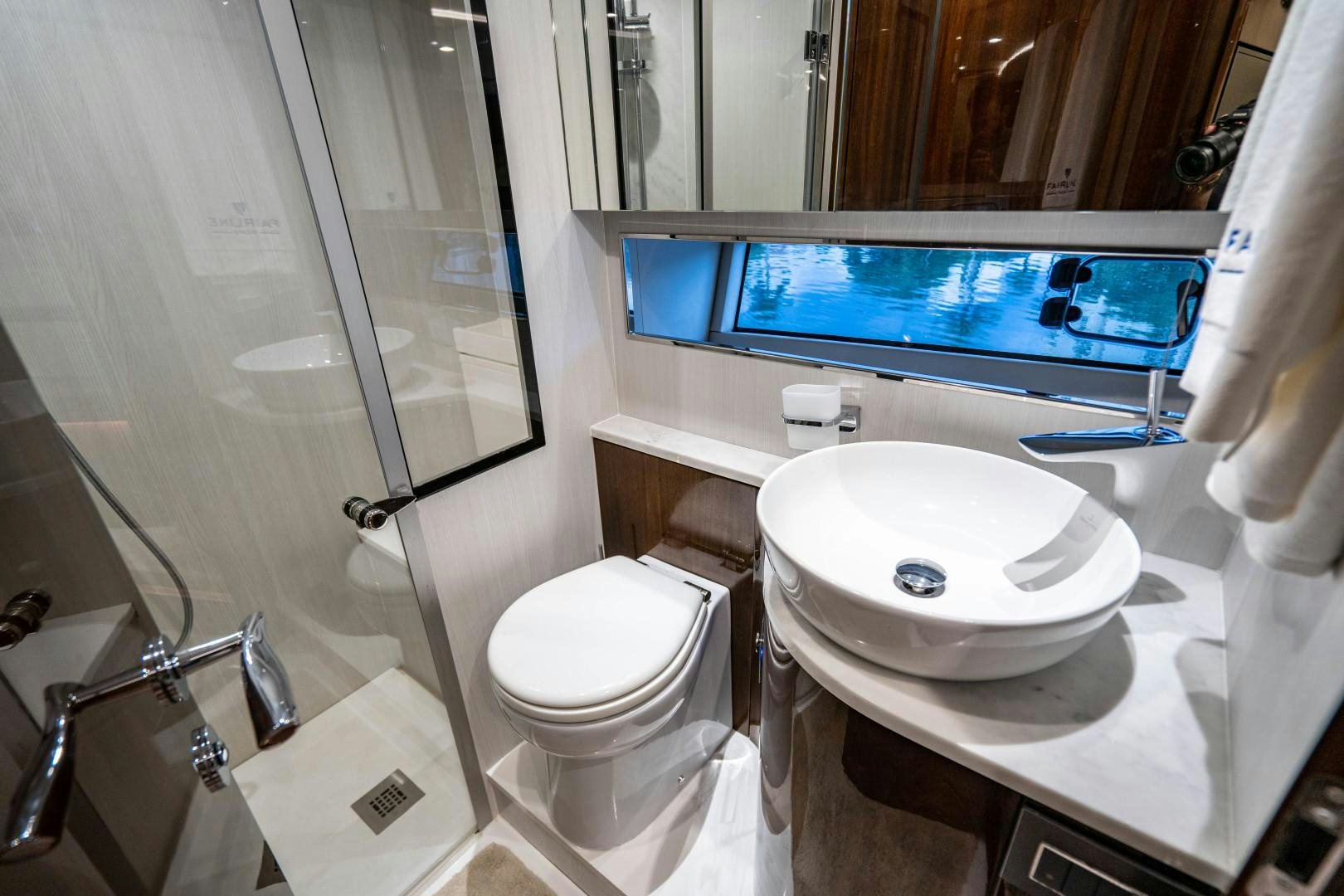 a bathroom with a television and a toilet aboard BLIND DATE Yacht for Sale