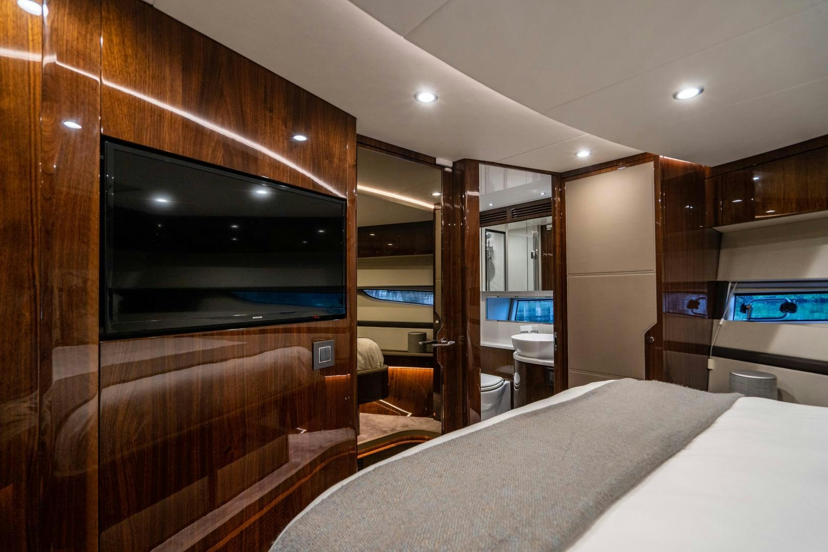 a room with a bed and a tv aboard BLIND DATE Yacht for Sale