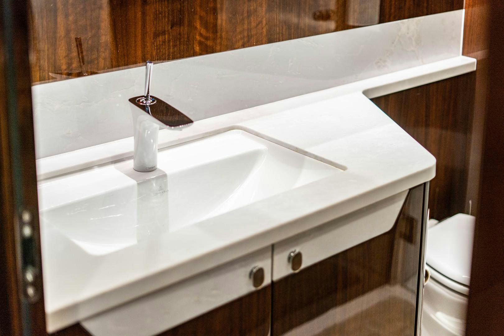 a white sink with a faucet aboard BLIND DATE Yacht for Sale