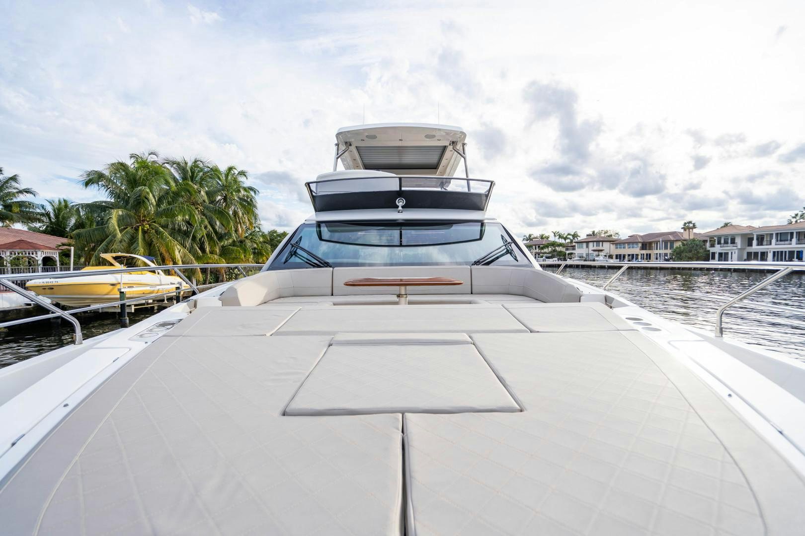 a white car parked on a dock aboard BLIND DATE Yacht for Sale