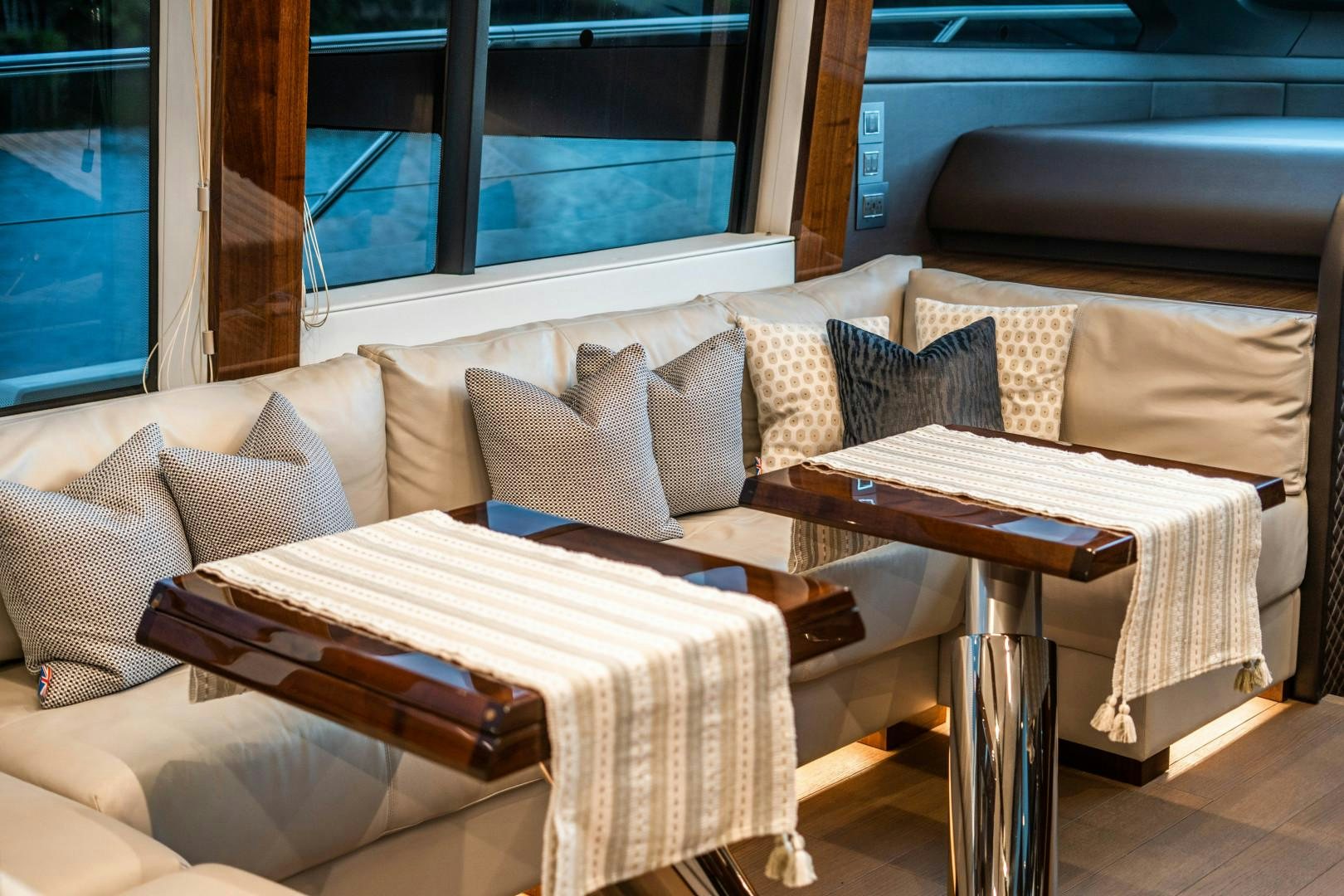 a bed with a table and couch aboard BLIND DATE Yacht for Sale