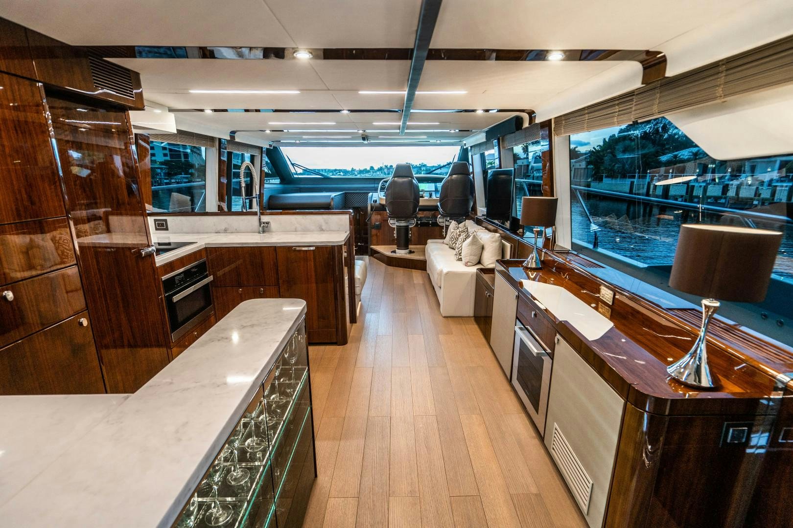 a room with a wood floor and a wood floor and a pool aboard BLIND DATE Yacht for Sale