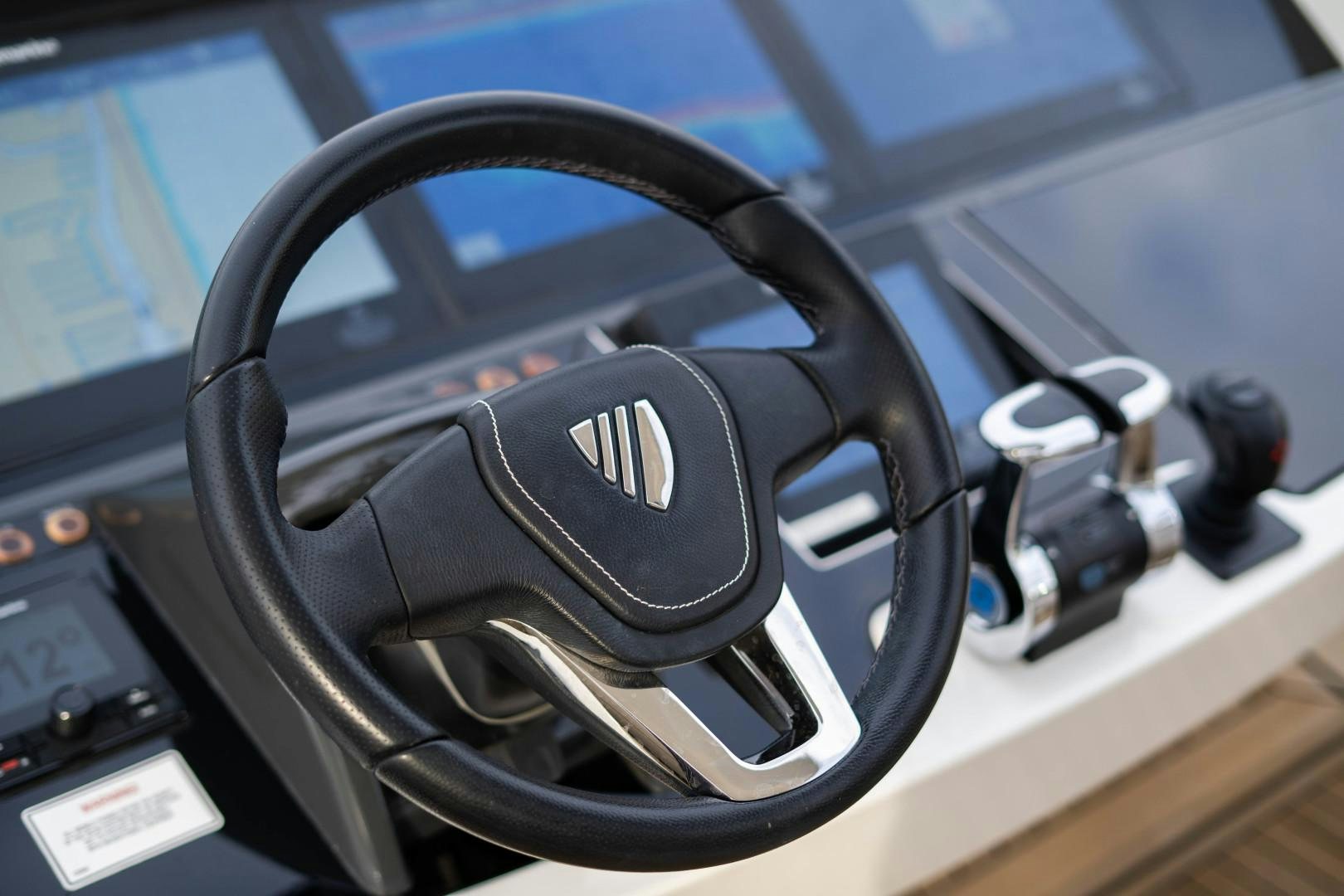 a steering wheel and dashboard of a car aboard BLIND DATE Yacht for Sale