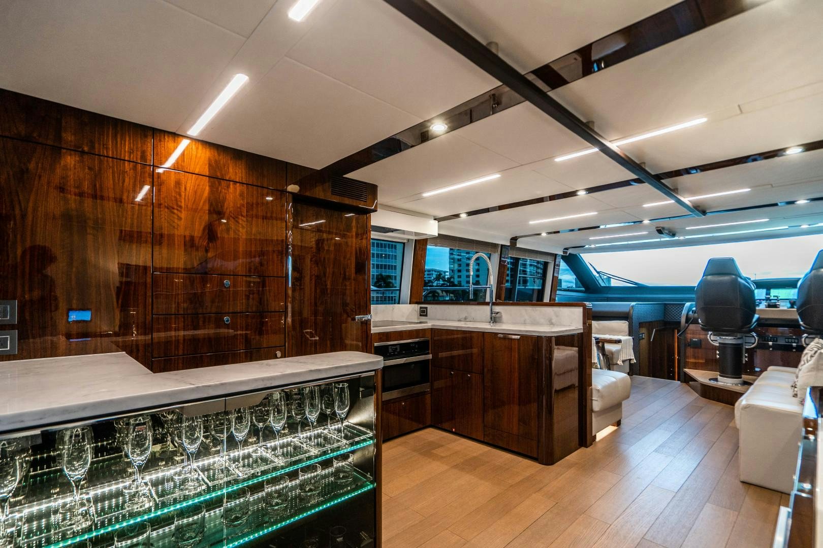 a room with a large window and a wood floor with a wood floor aboard BLIND DATE Yacht for Sale