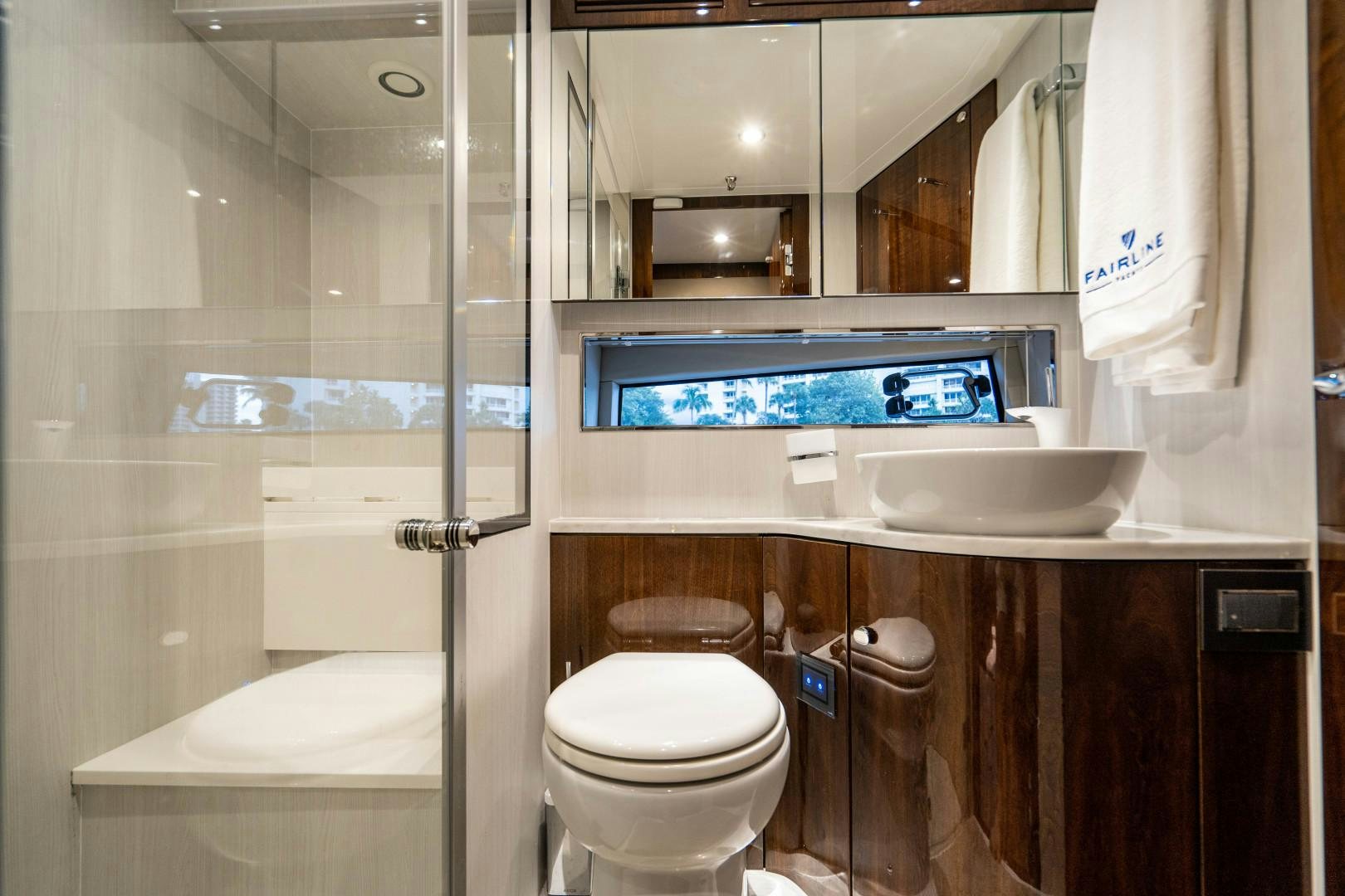 a bathroom with a toilet and sink aboard BLIND DATE Yacht for Sale