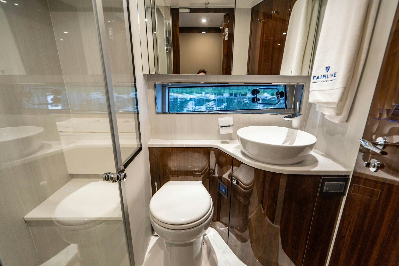 a bathroom with a bathtub toilet and sink aboard BLIND DATE Yacht for Sale