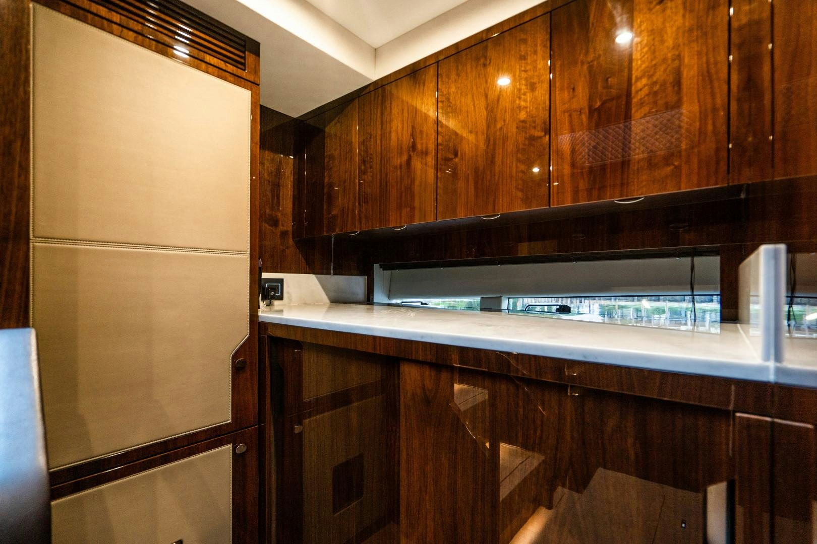 a kitchen with wooden cabinets aboard BLIND DATE Yacht for Sale