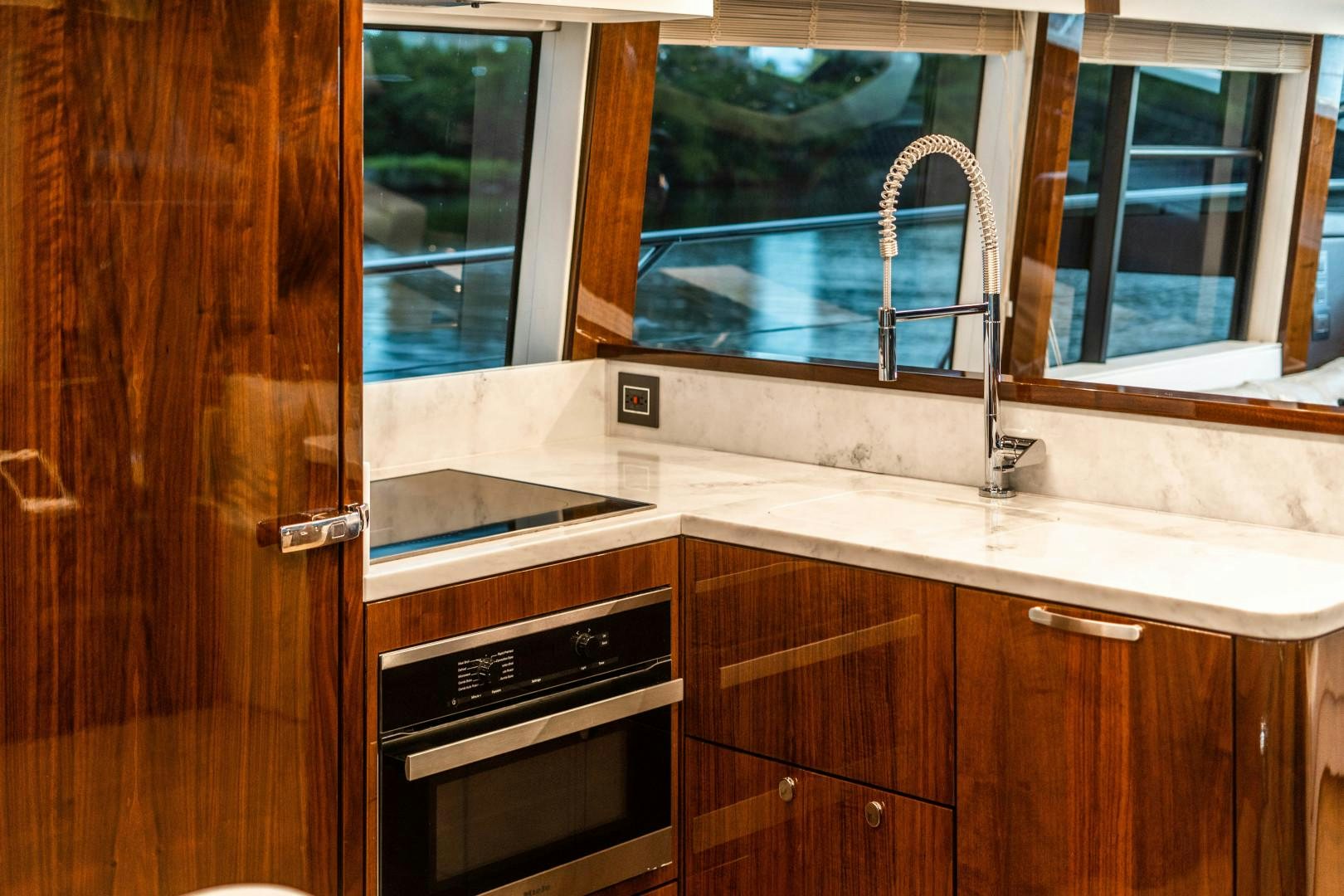 a kitchen with a sink and a window aboard BLIND DATE Yacht for Sale