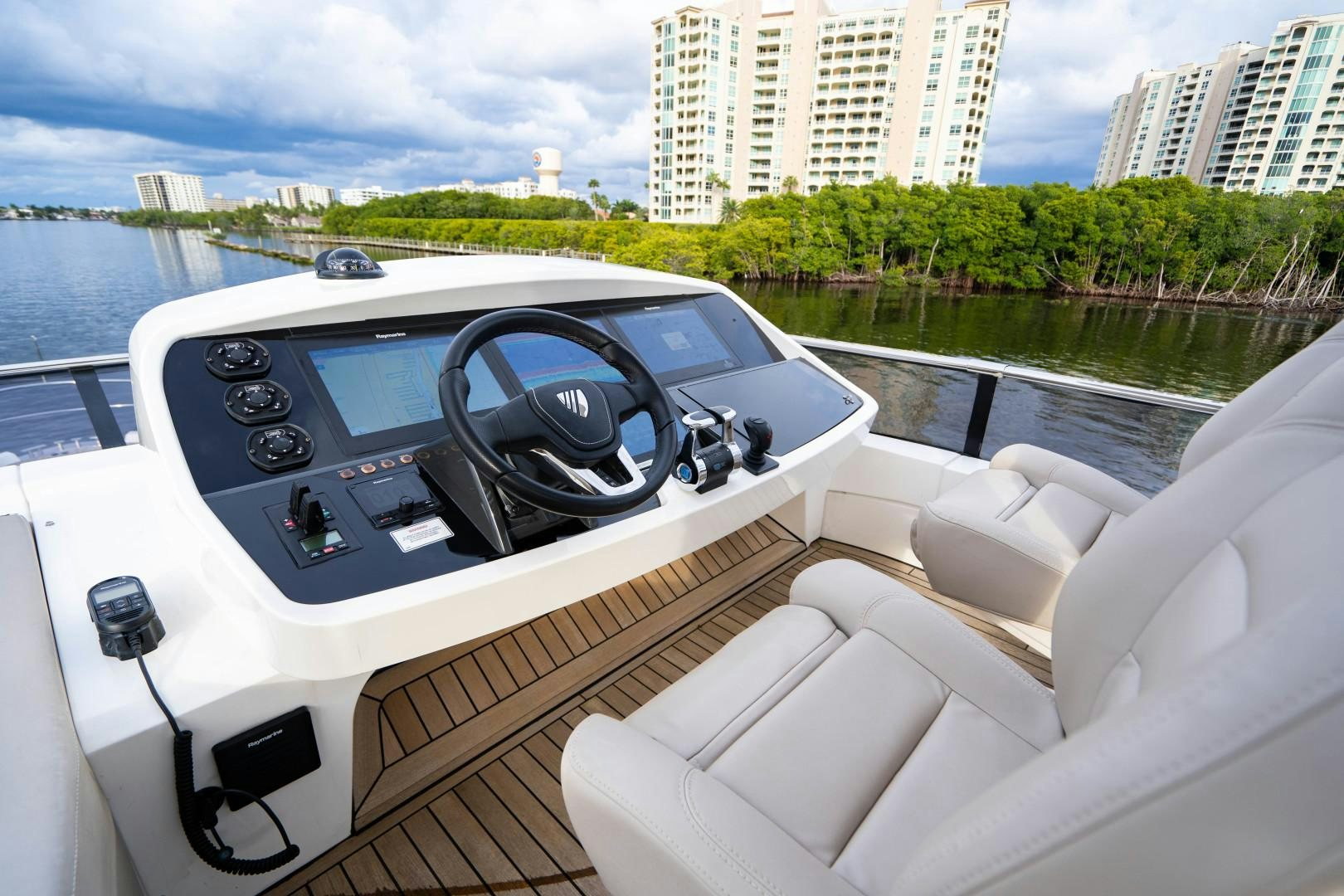 a white car with a steering wheel on a boat aboard BLIND DATE Yacht for Sale