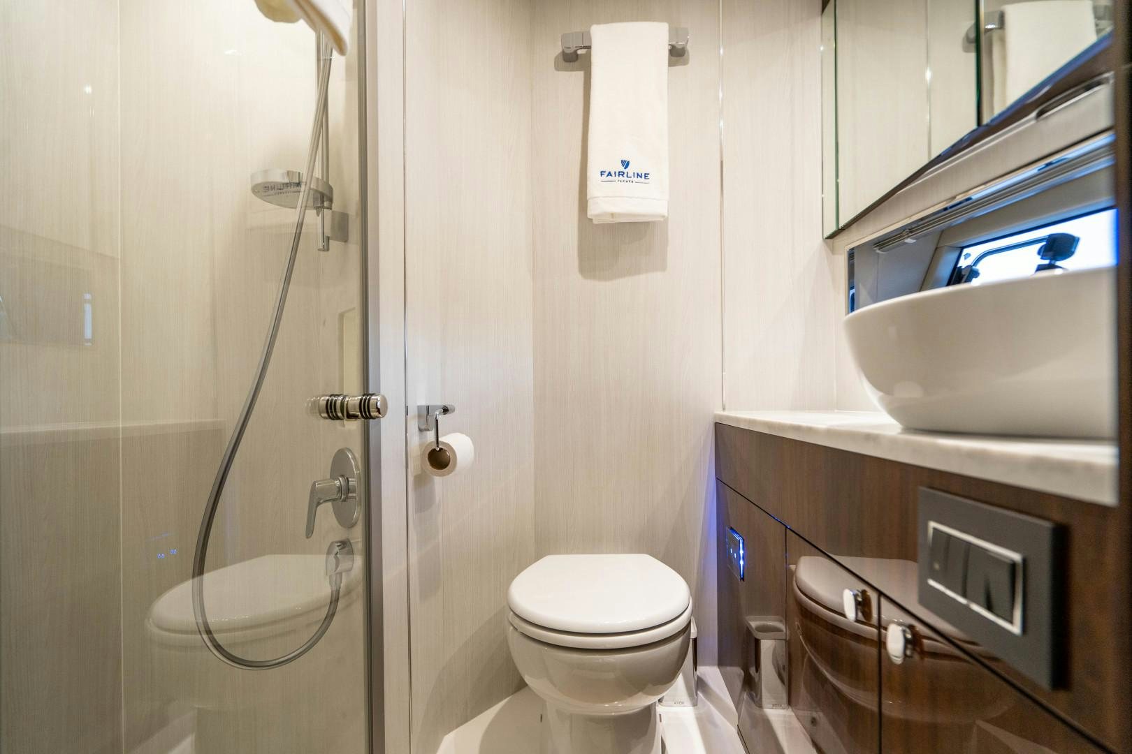 a bathroom with a toilet and sink aboard BLIND DATE Yacht for Sale