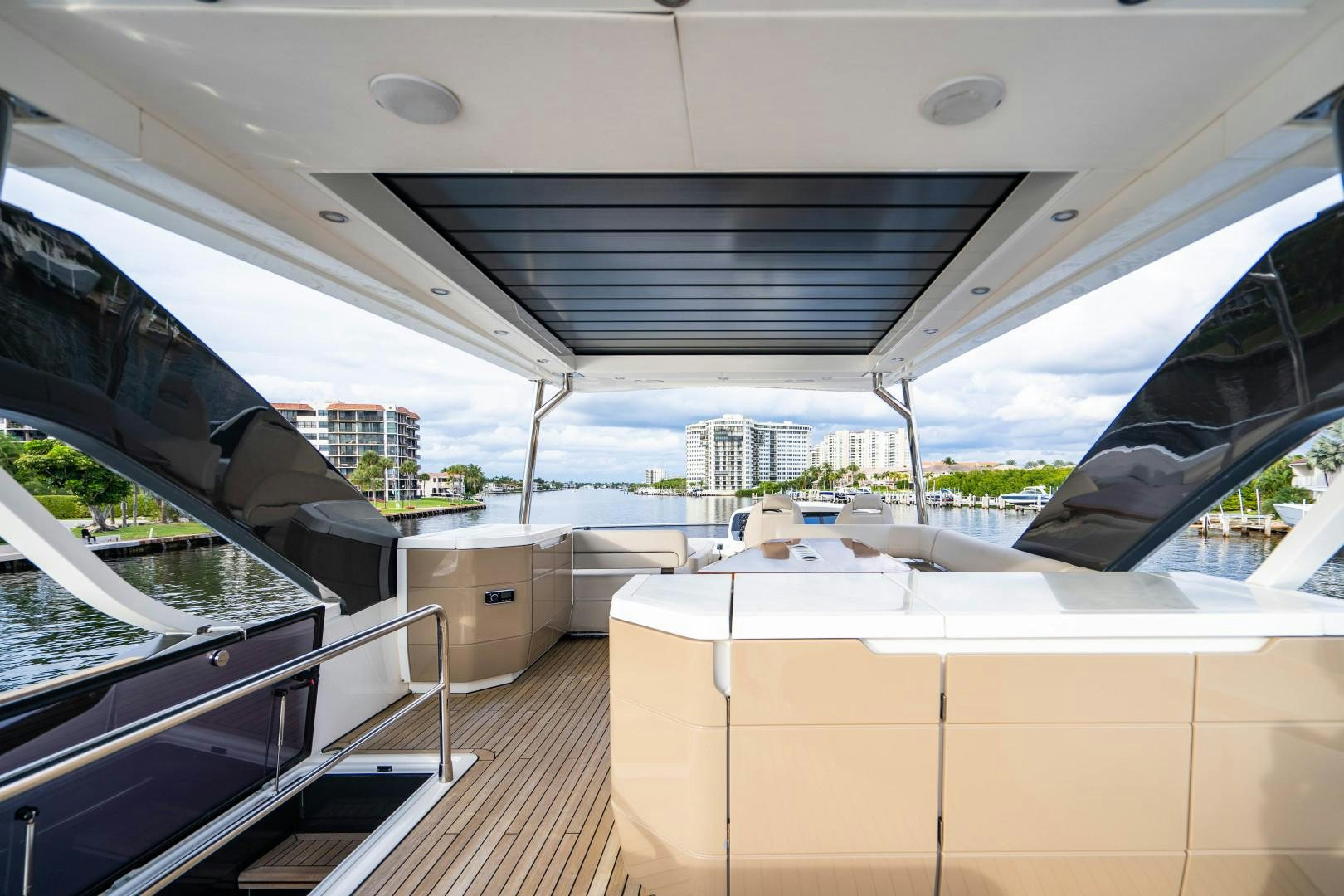 a room with a view of a city and water aboard BLIND DATE Yacht for Sale