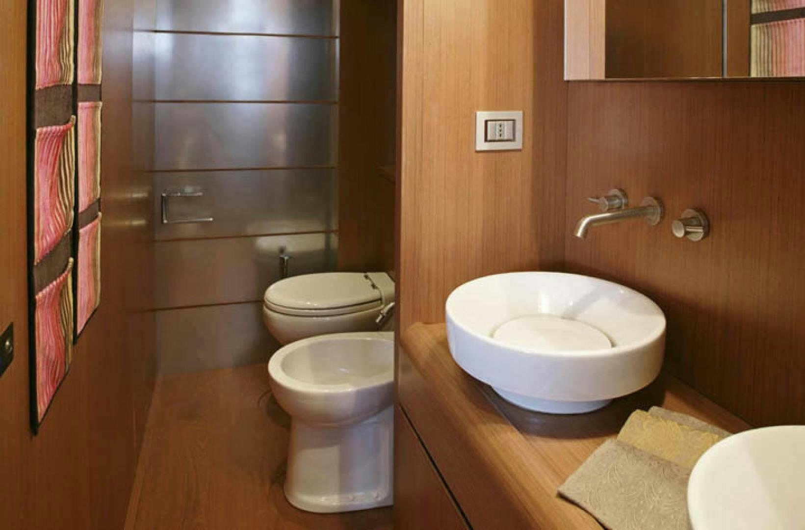 a bathroom with a sink and toilet aboard BLUWATER Yacht for Sale