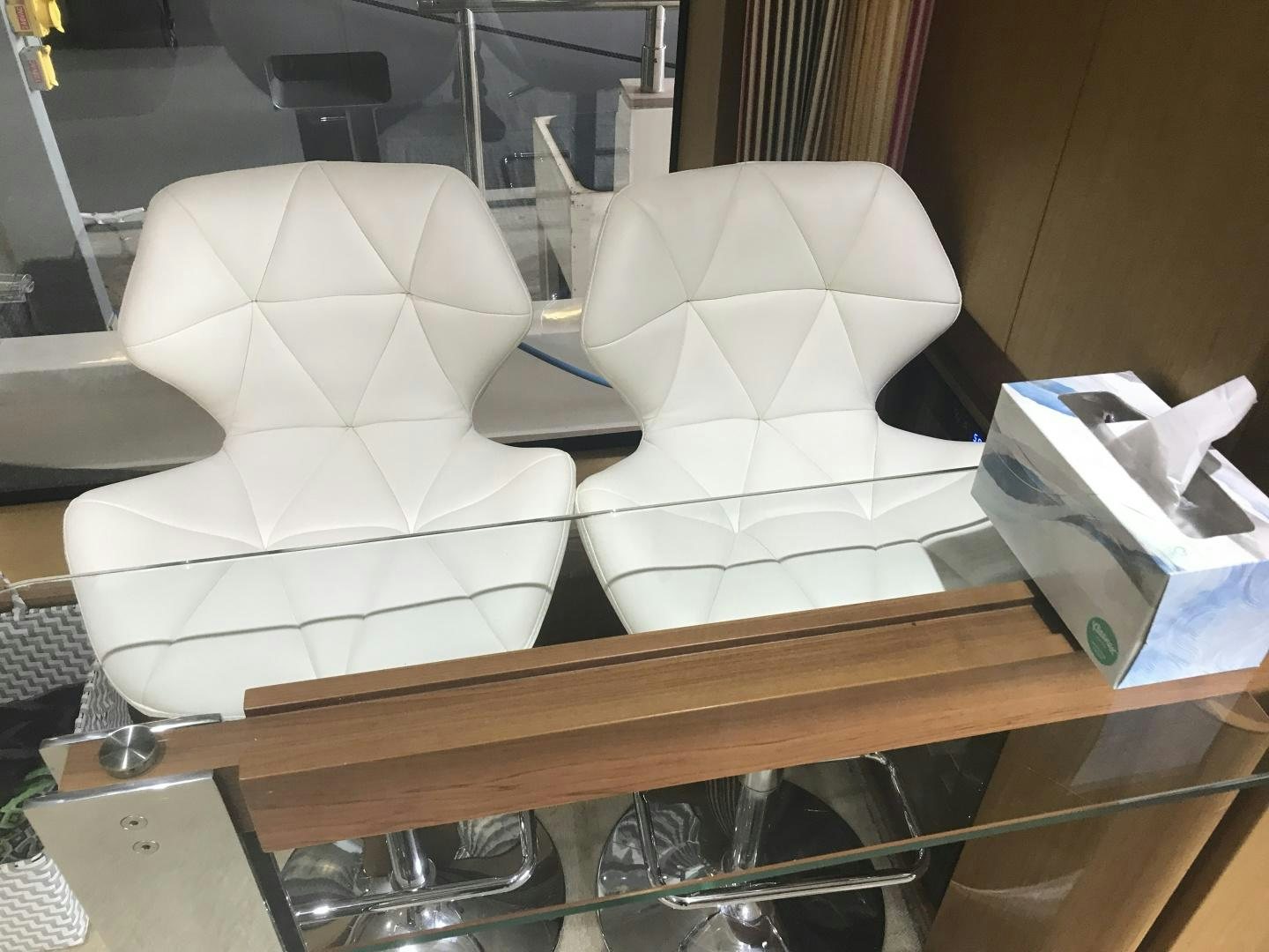 a group of white chairs on a table aboard BLUWATER Yacht for Sale