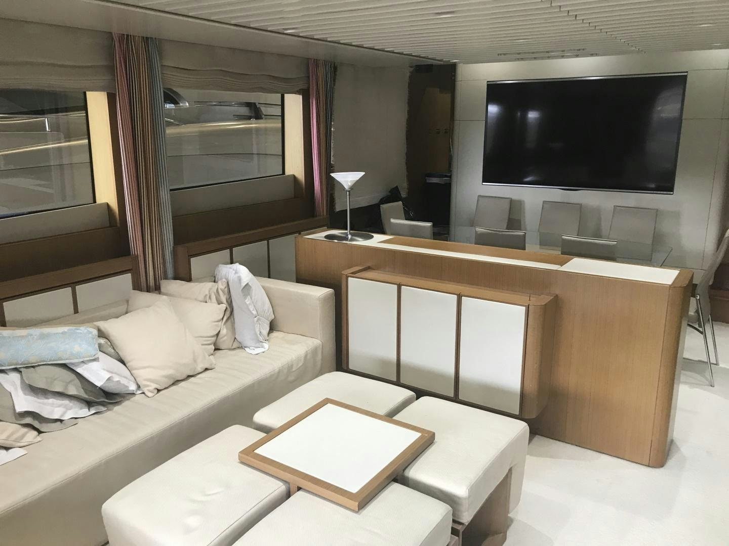 a room with a couch and a tv aboard BLUWATER Yacht for Sale