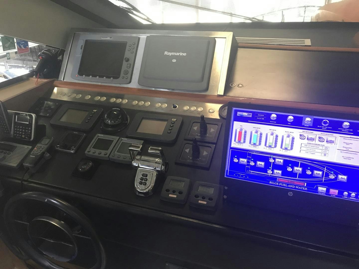 a radio and a monitor aboard BLUWATER Yacht for Sale