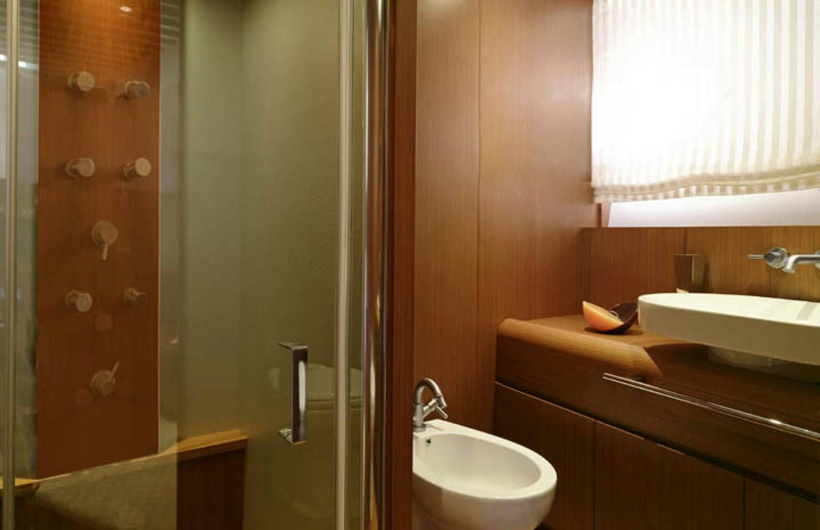 a bathroom with a sink and a shower aboard BLUWATER Yacht for Sale