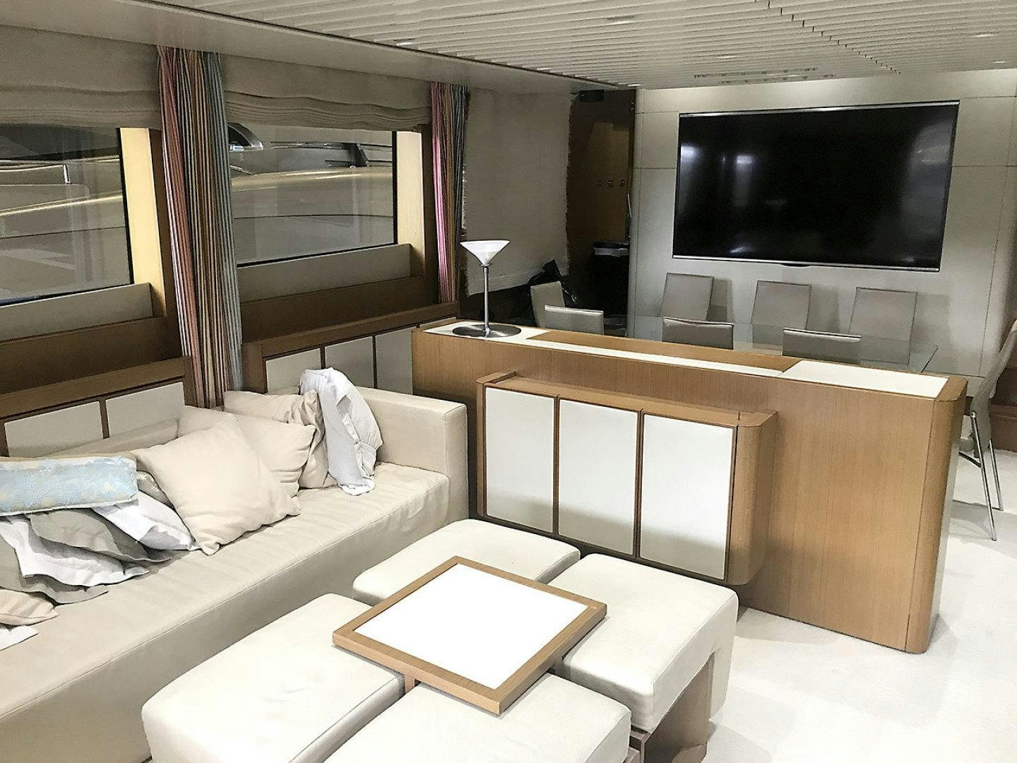 a room with a couch and a tv aboard BLUWATER Yacht for Sale