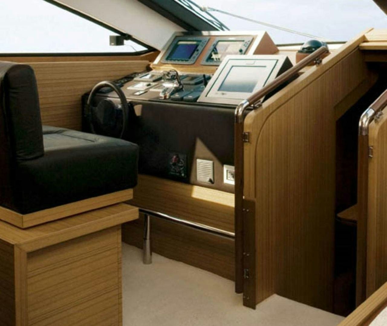 a desk with a computer on it aboard BLUWATER Yacht for Sale