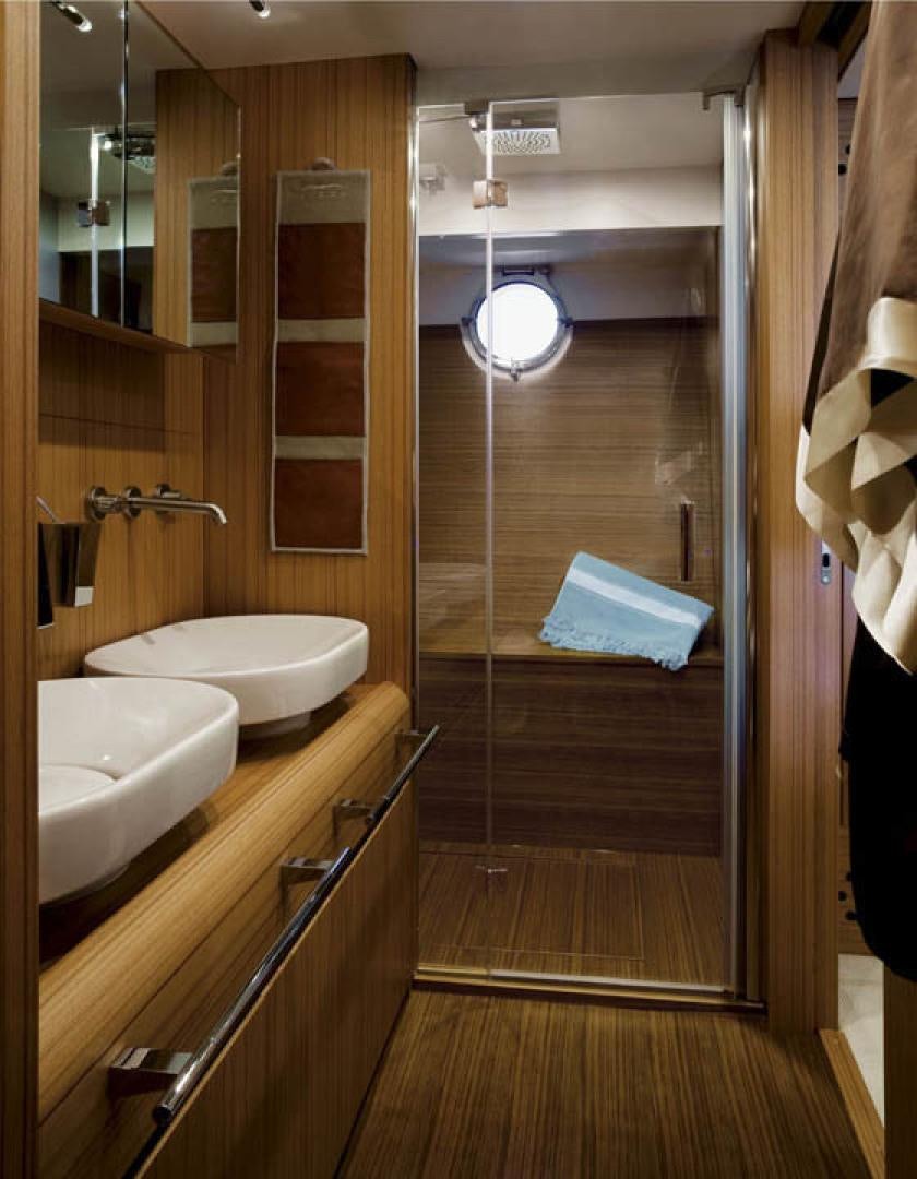a bathroom with a shower and sink aboard BLUWATER Yacht for Sale