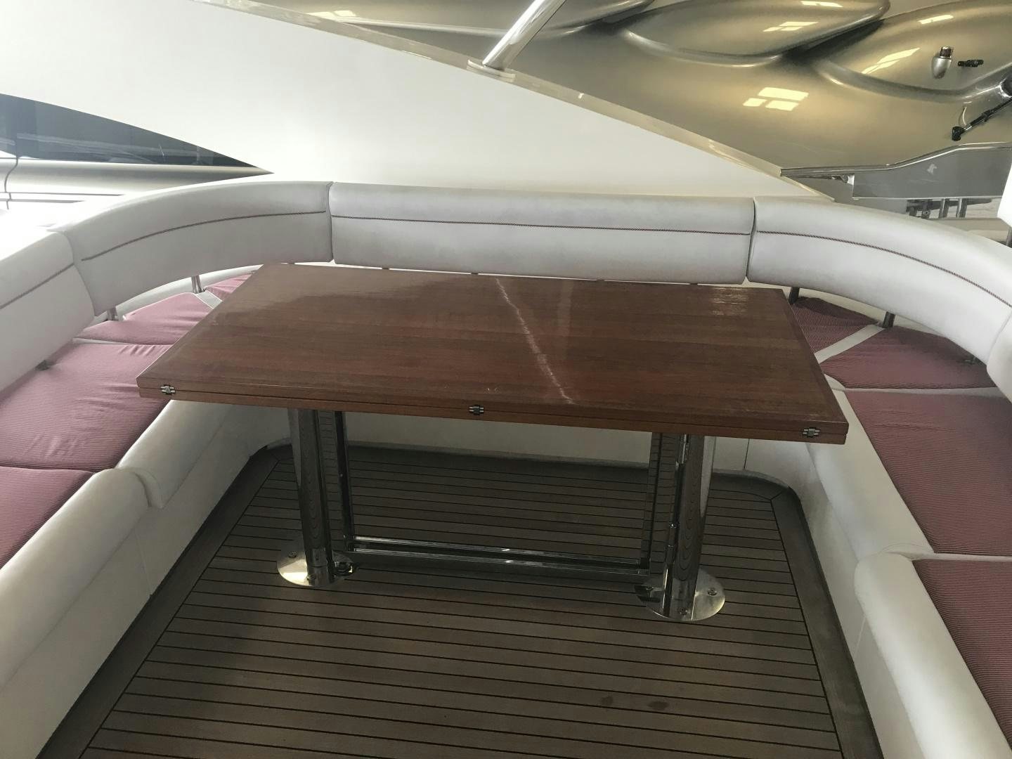 a wooden table on a boat aboard BLUWATER Yacht for Sale