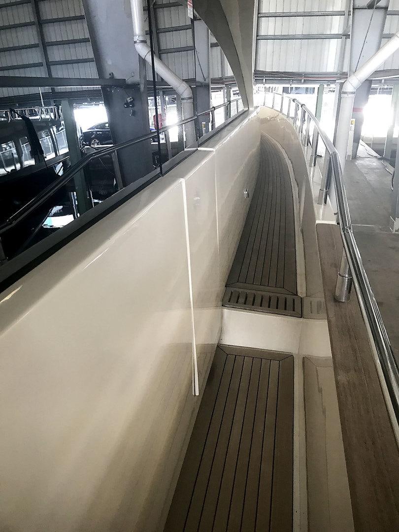 a long hallway with a few escalators aboard BLUWATER Yacht for Sale