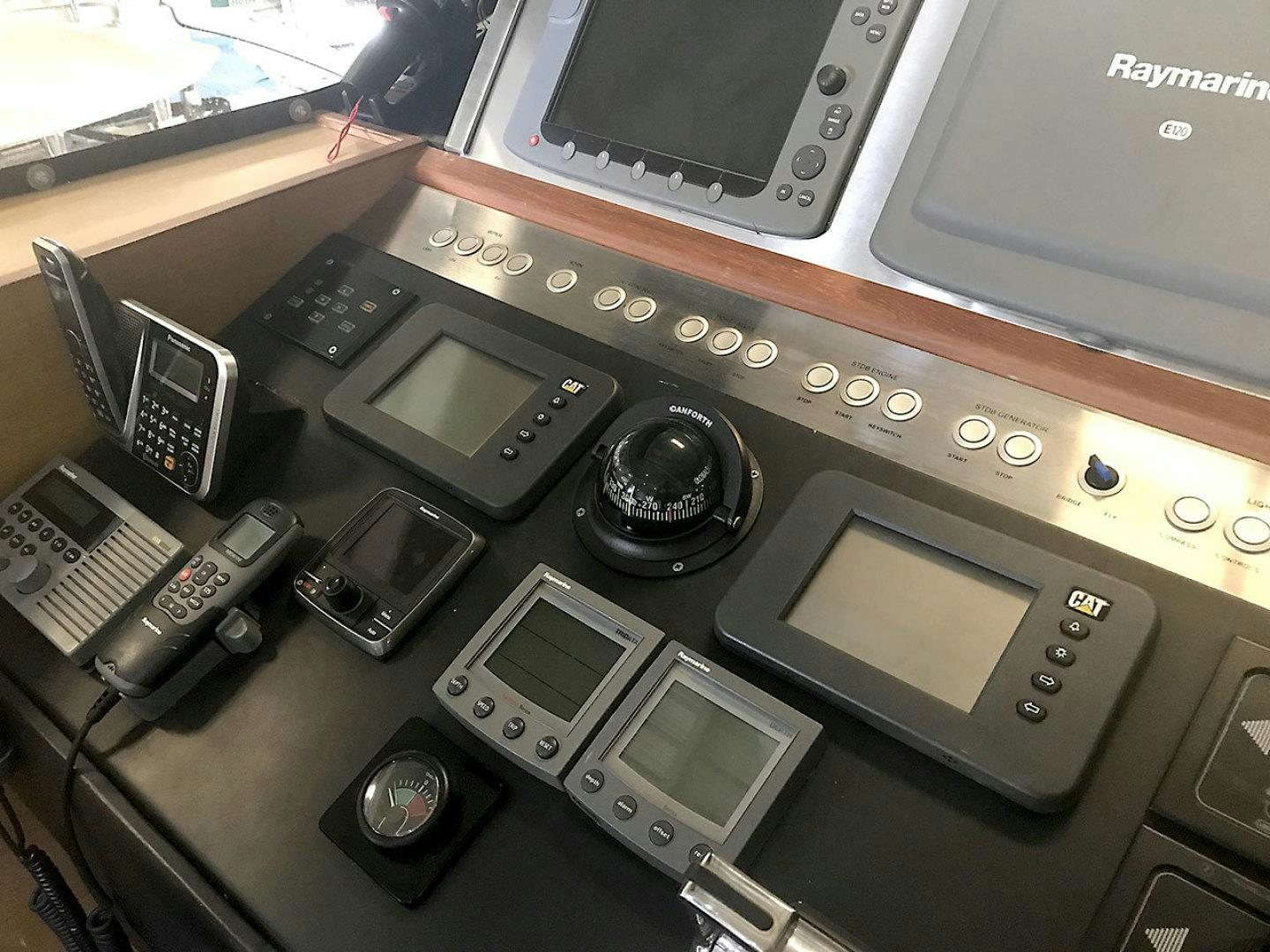 a group of cell phones on a table aboard BLUWATER Yacht for Sale
