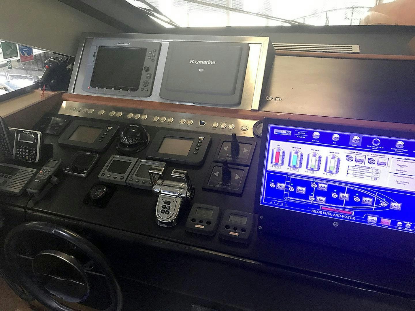a radio and a monitor aboard BLUWATER Yacht for Sale