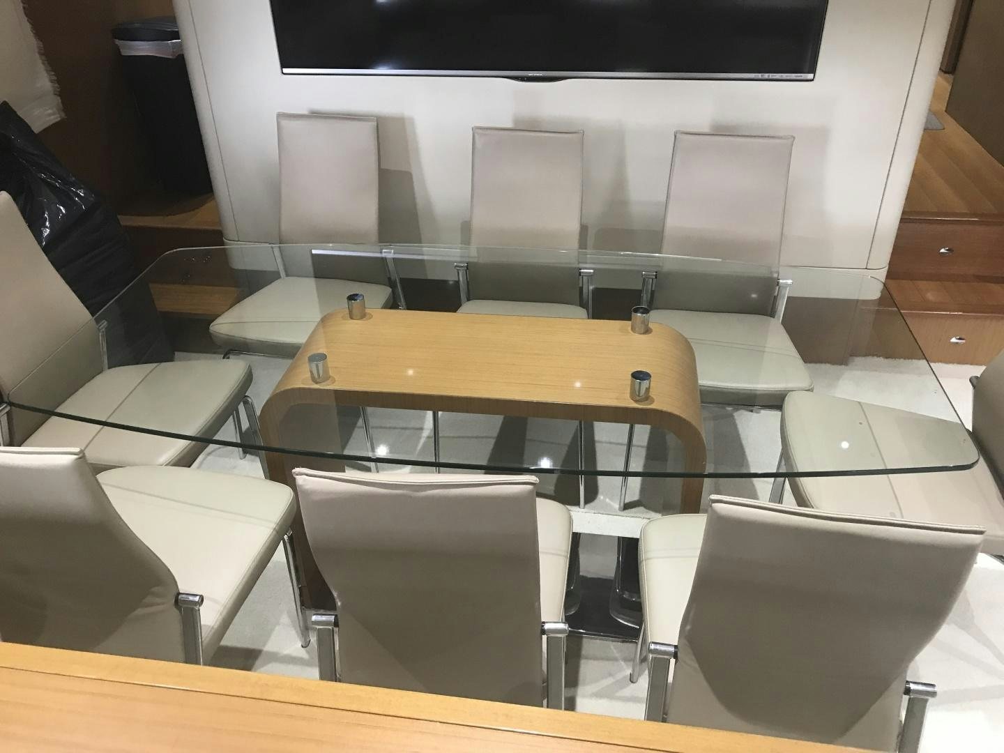 a room with a table and chairs aboard BLUWATER Yacht for Sale