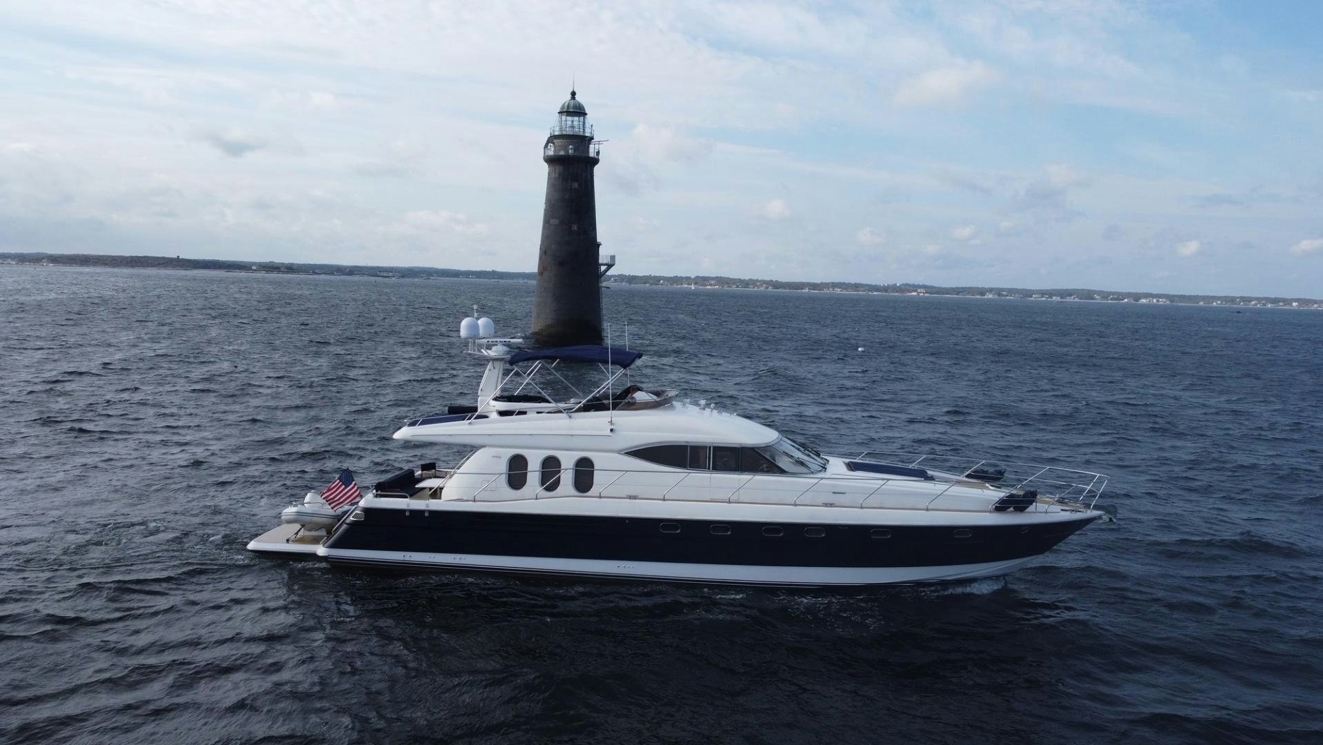 a white boat in the water aboard JOIE DU ROI Yacht for Sale