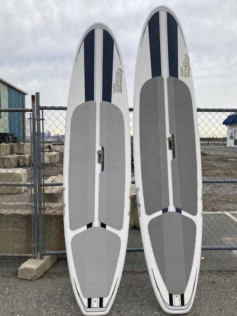 a couple of surfboards stand near each other aboard JOIE DU ROI Yacht for Sale