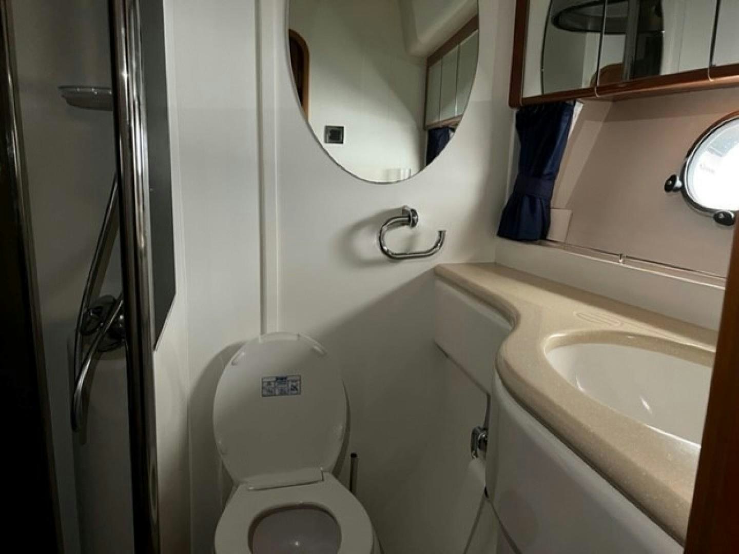 a bathroom with a toilet and sink aboard JOIE DU ROI Yacht for Sale