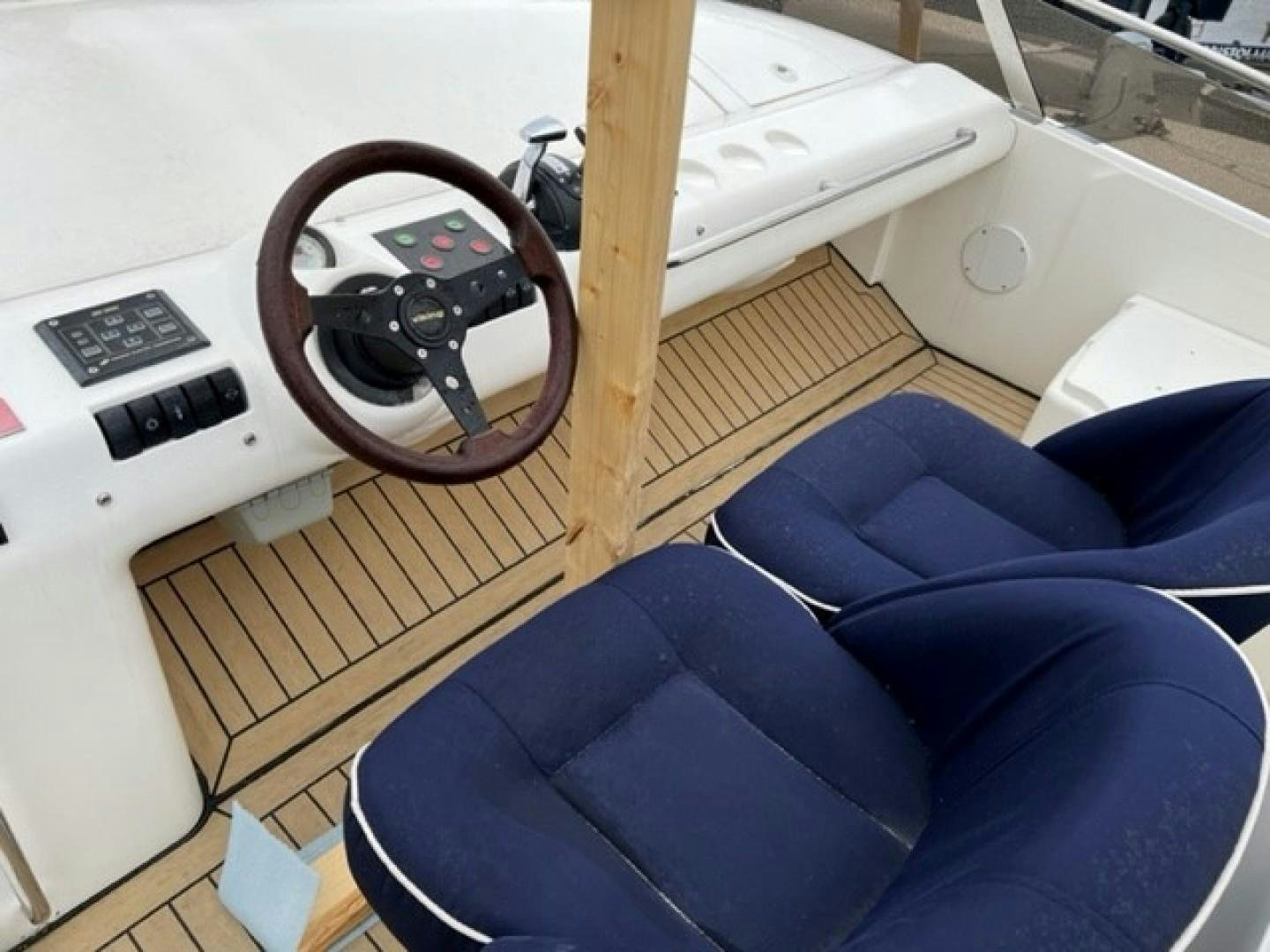 a guitar on a stand aboard JOIE DU ROI Yacht for Sale