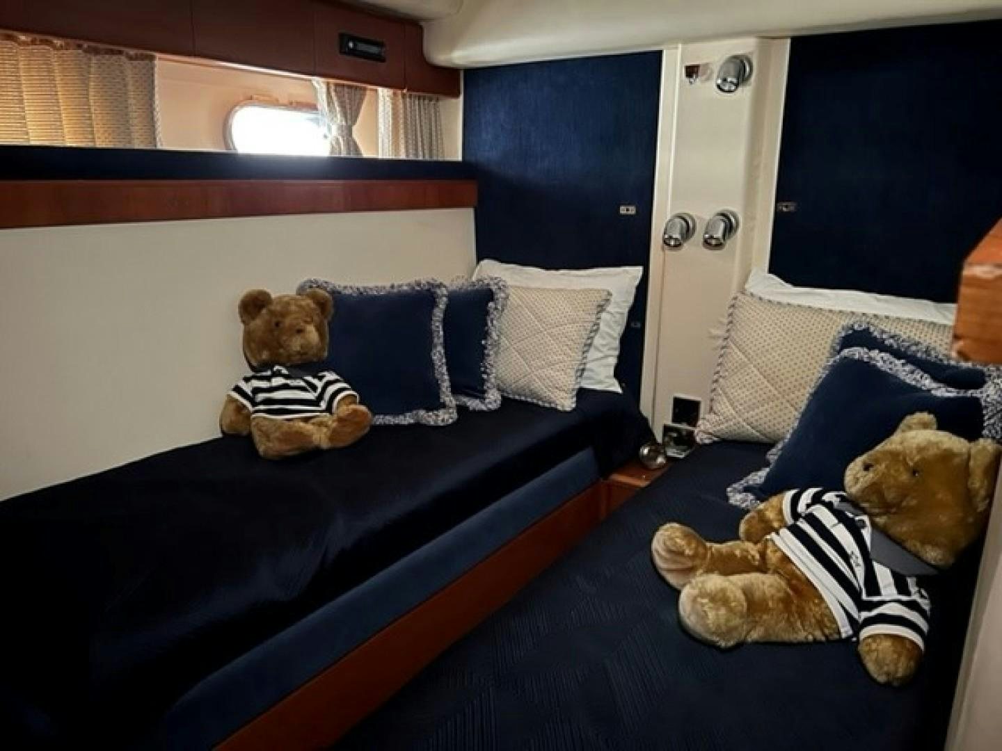teddy bears on a bed aboard JOIE DU ROI Yacht for Sale