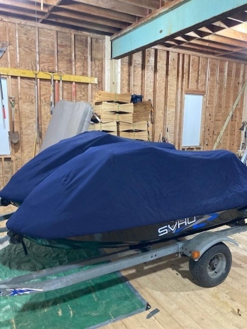 a blue and black trailer in a wooden cabin aboard JOIE DU ROI Yacht for Sale