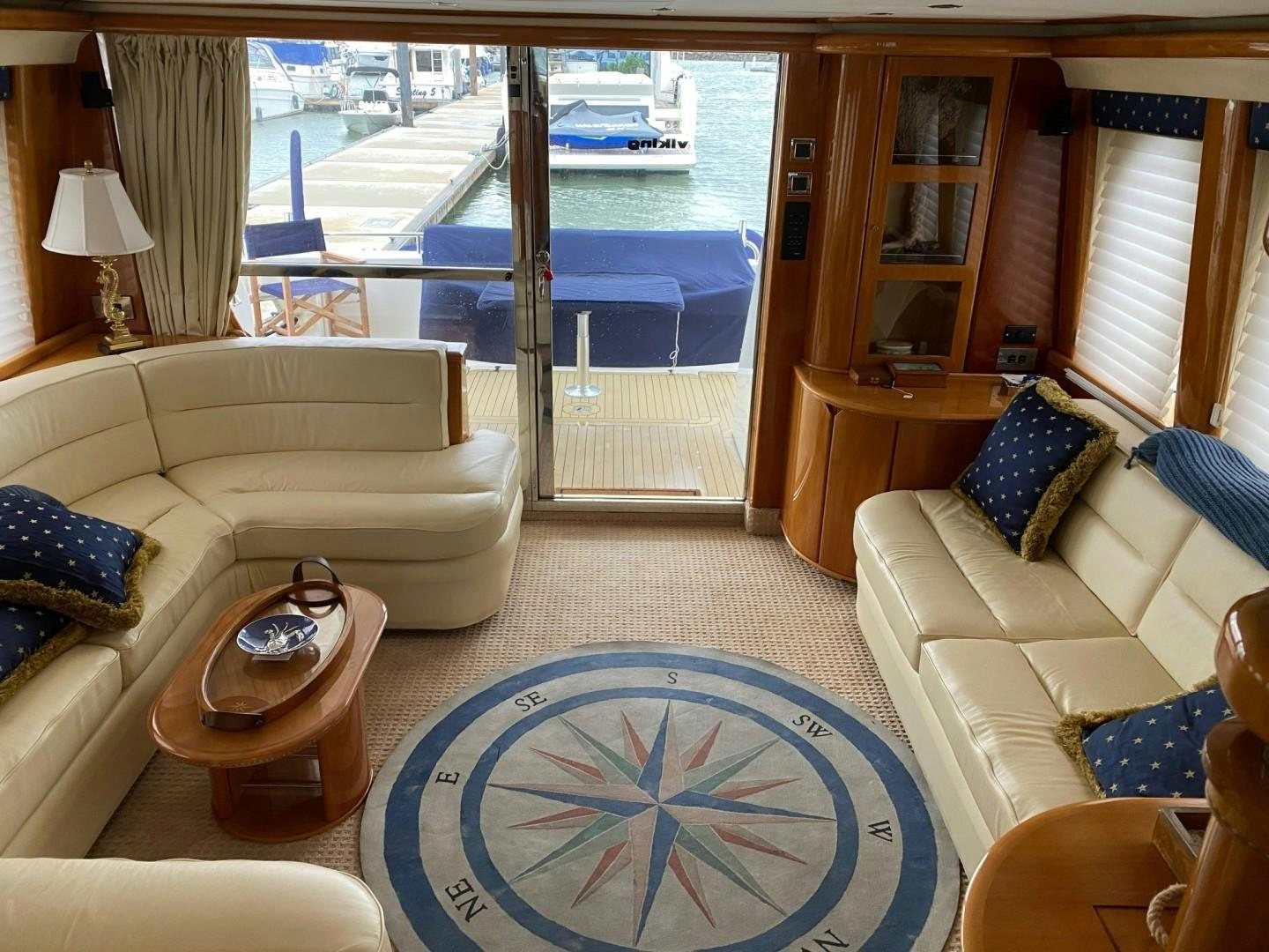 a living room with a large window aboard JOIE DU ROI Yacht for Sale