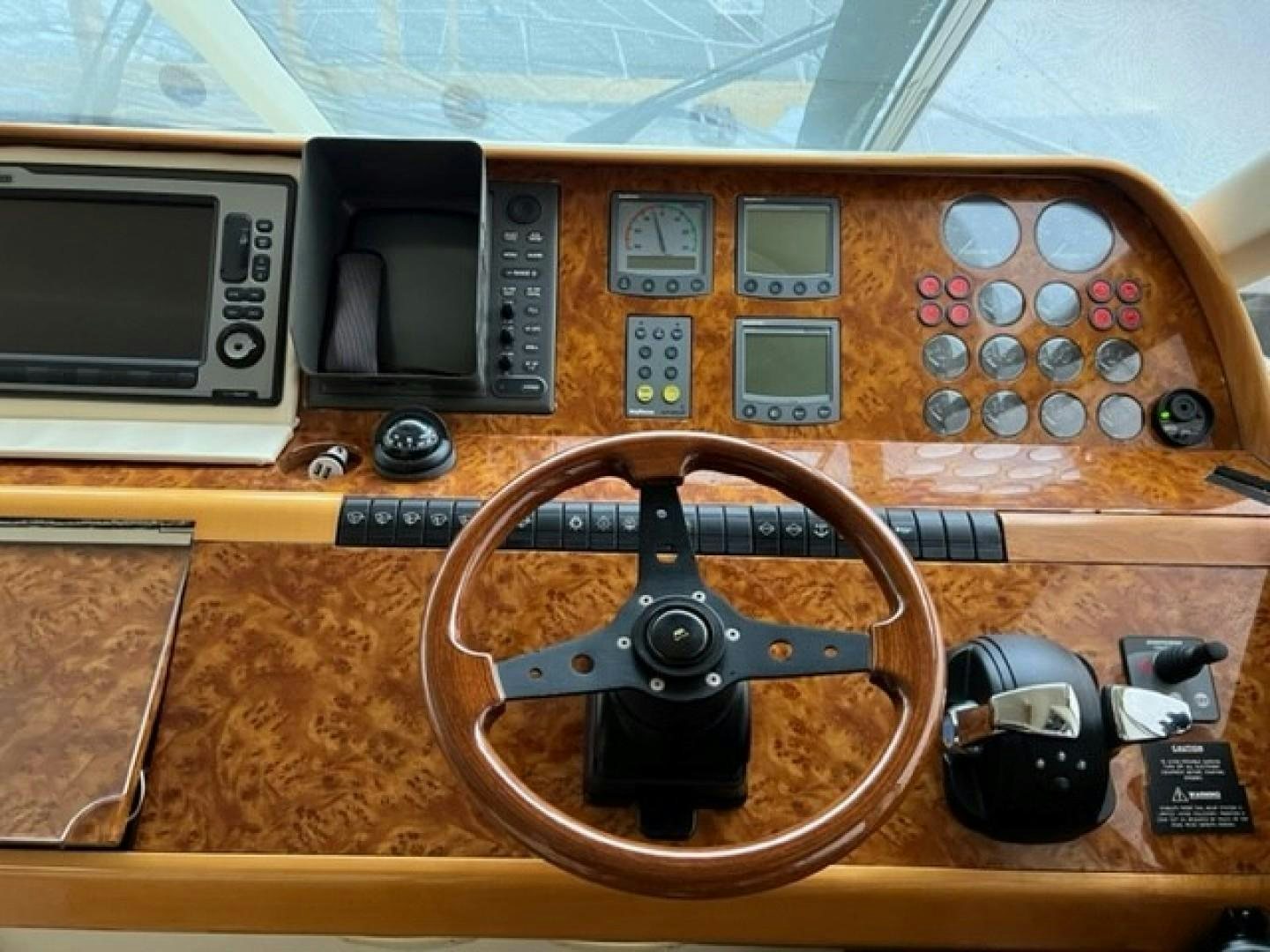 a wooden table with a radio and a cd player aboard JOIE DU ROI Yacht for Sale