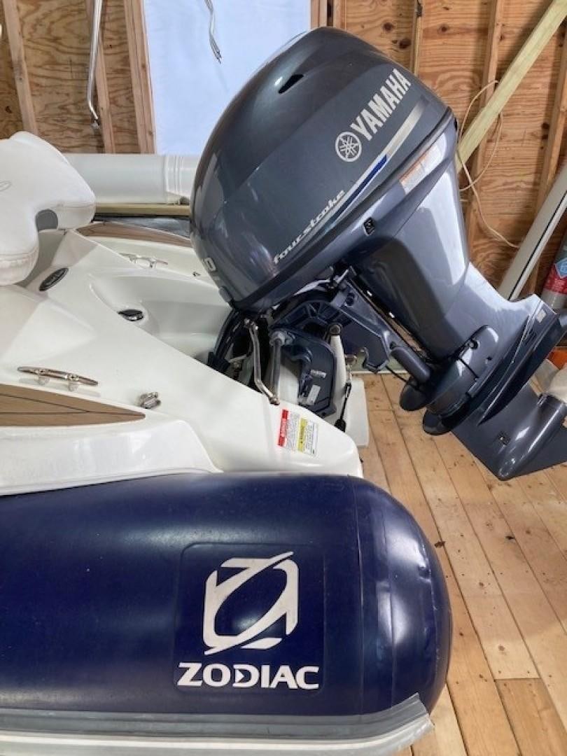 a black and silver camera on a wooden surface aboard JOIE DU ROI Yacht for Sale